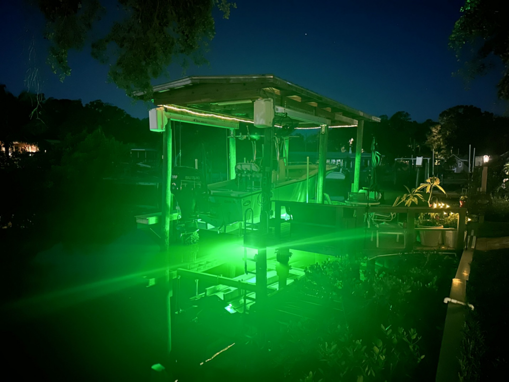 A large space with green colored lights. 