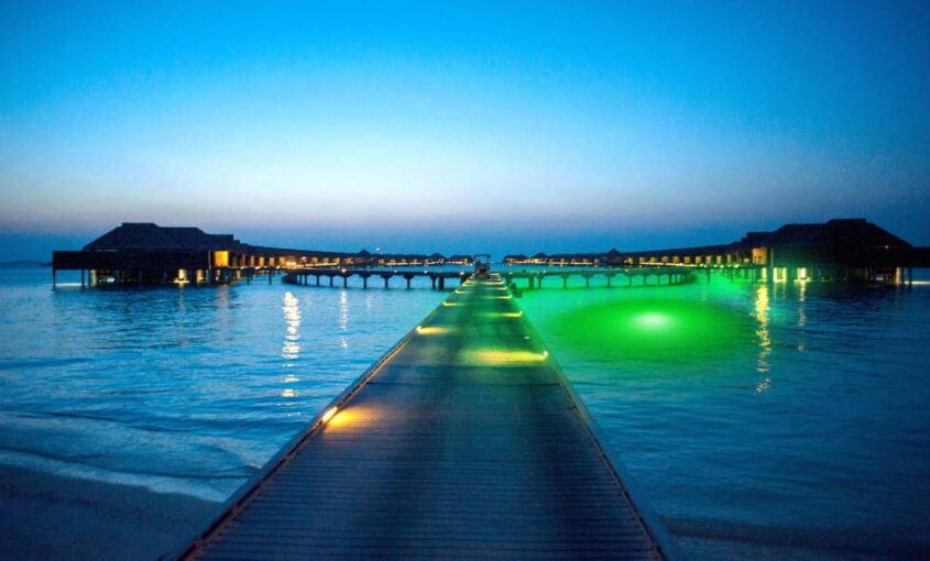 A large dock area with green underwater LED light.