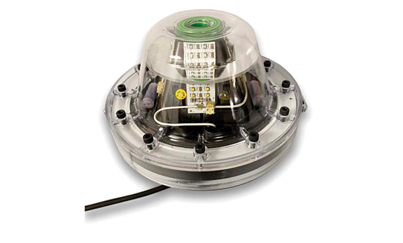 A green colored LED light with wires and other installment features.