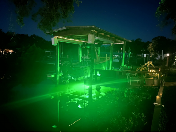 A dock illuminated by green light