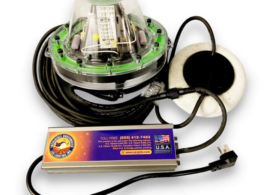 The complete green underwater LED light with wires.