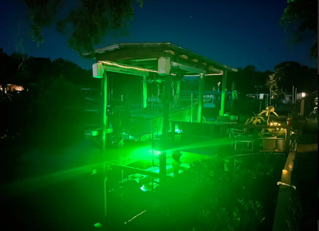 A green underwater light in a waterfront property. 